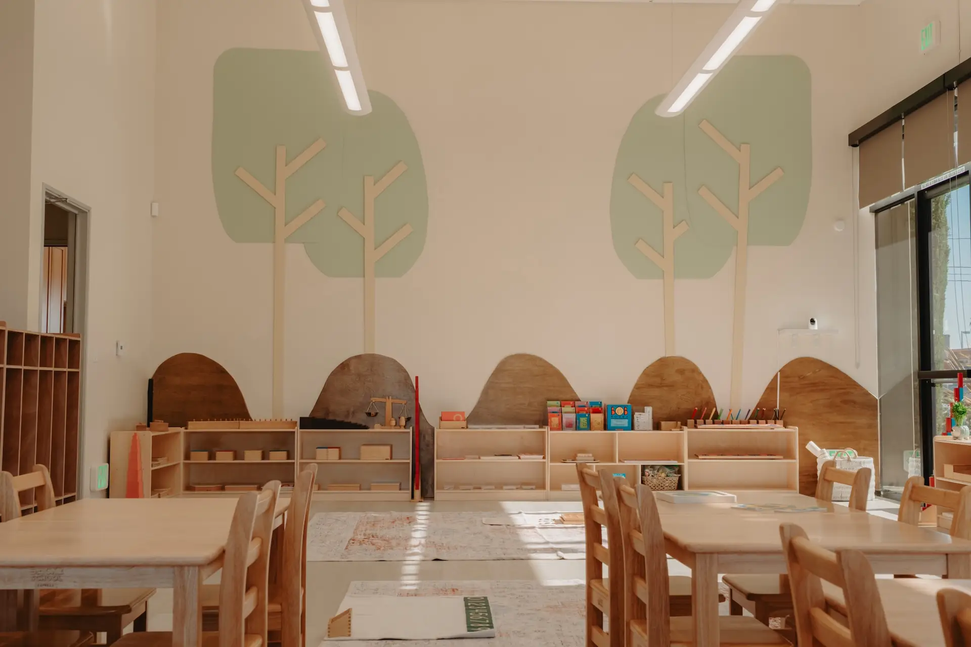 Preschool classroom with forest mural